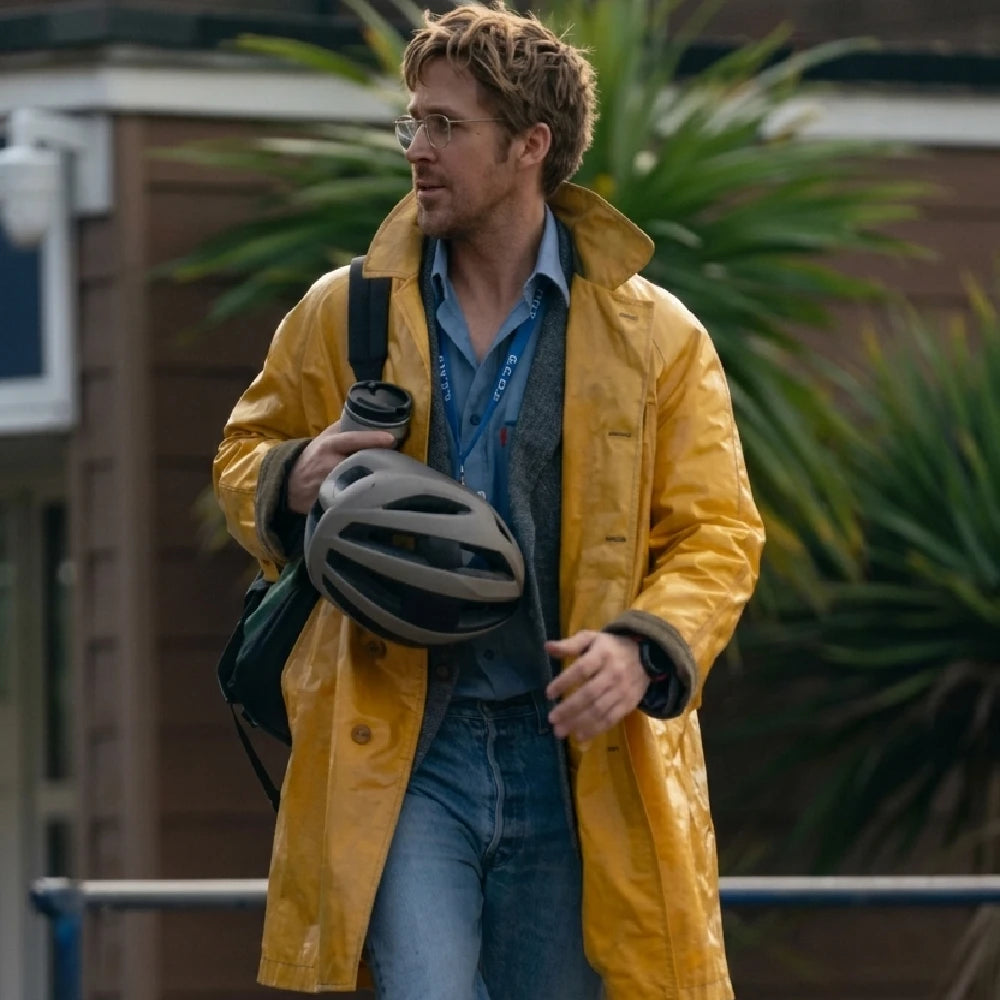 Project Hail Mary Ryan Gosling Yellow Coat featuring a textured finish, worn with a blue shirt and jeans while carrying a bicycle helmet.