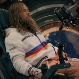 Cinematic shot of a character wearing the Project Hail Mary Ryan Gosling rainbow striped hooded jacket in a spaceship setting.